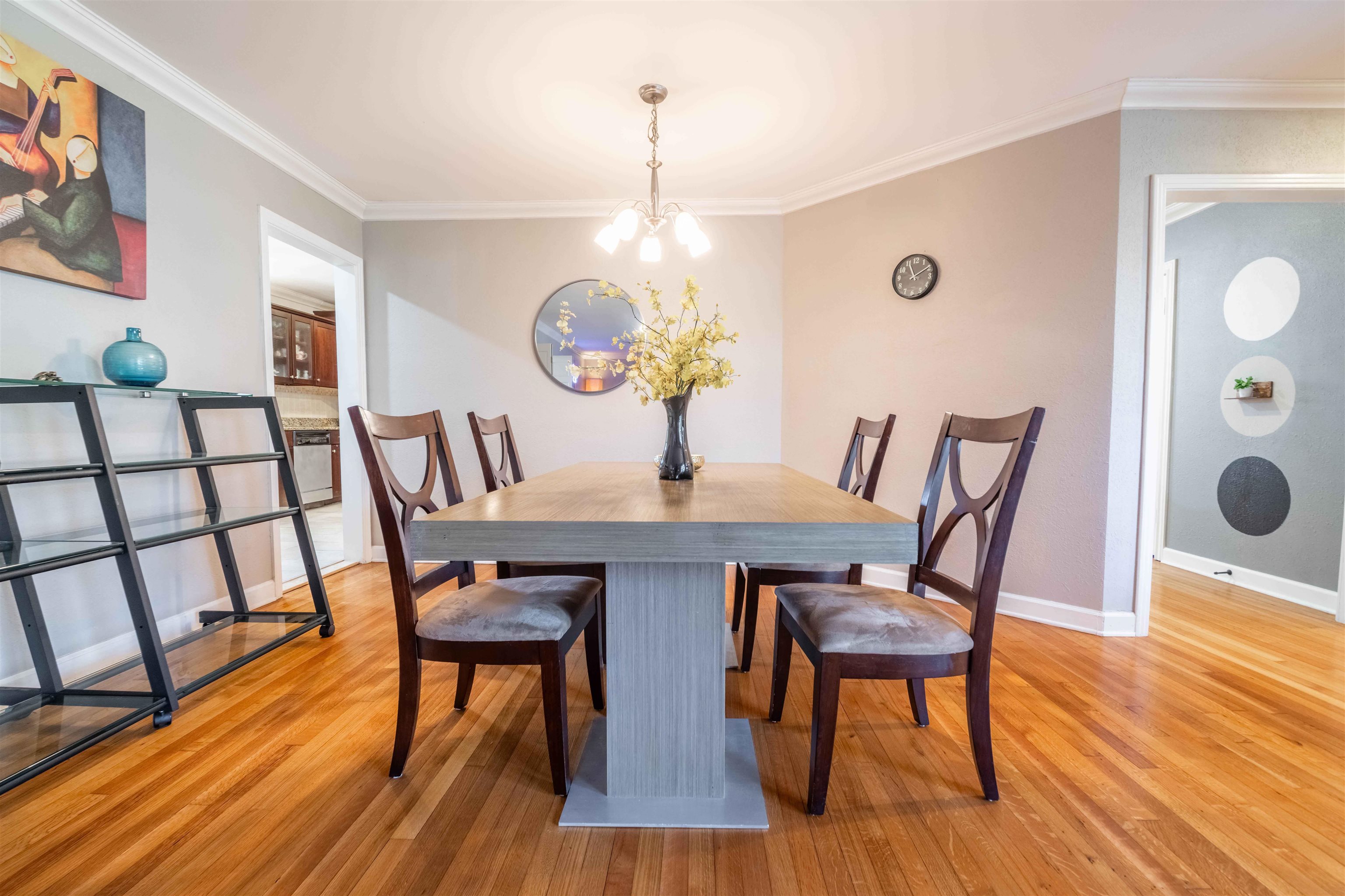 5099 Walnut Grove Road Memphis, TN 38117 - Photo 9 of 24 Dining area with suspended lighting, crown molding, and light wood-type flooring