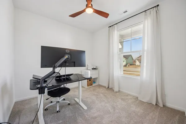 a view of a workspace with furniture