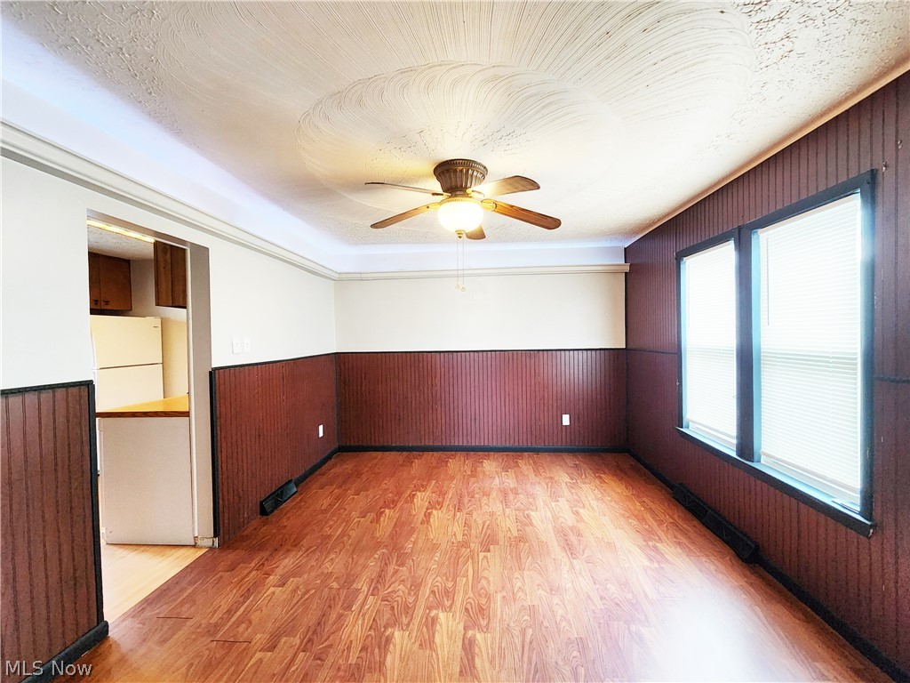 30 West Wilbeth Road, Unit A Akron, OH 44301 - Photo 4 of 16 Spare room with light wood-type flooring and ceiling fan