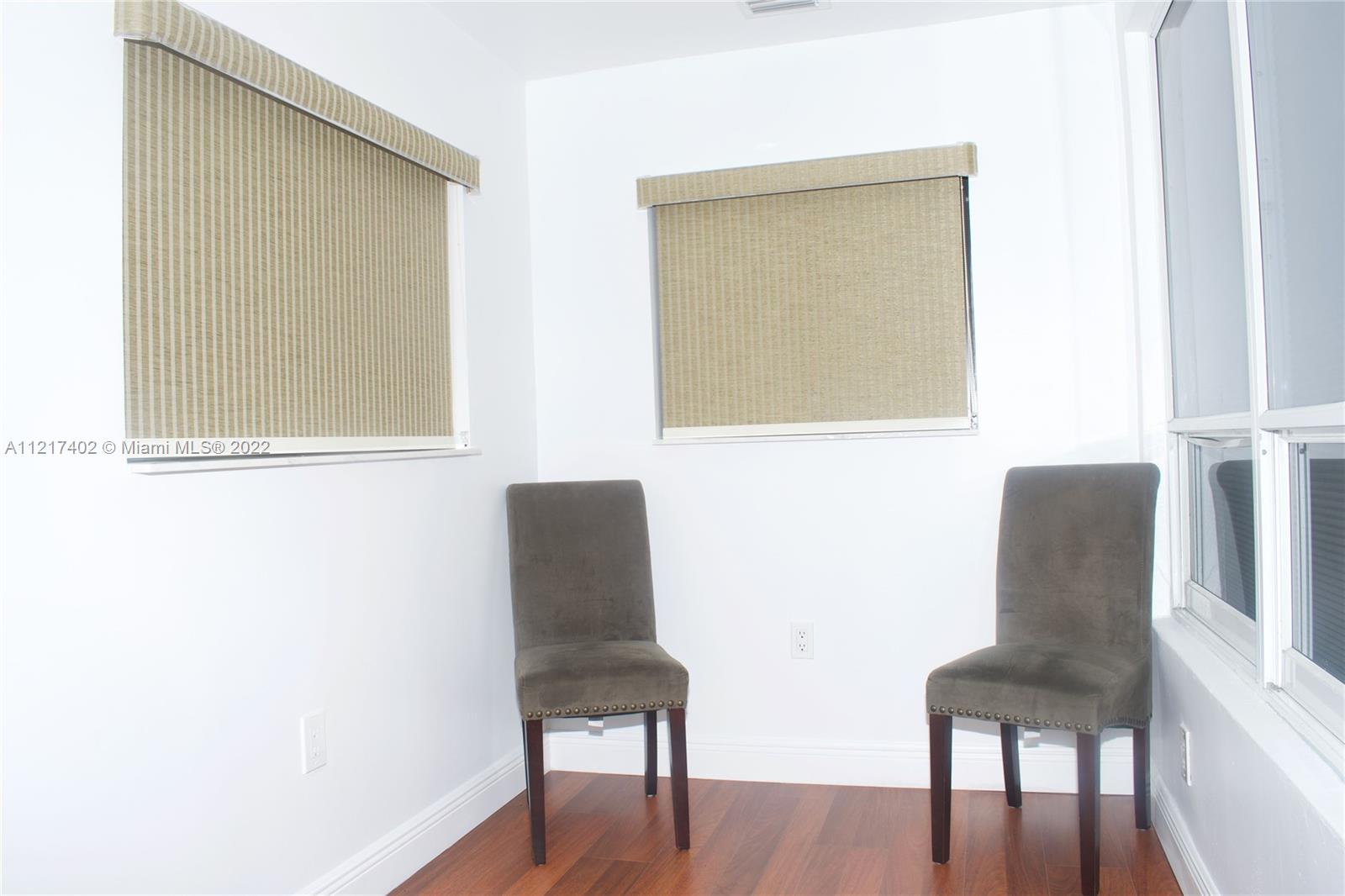 Westview Miami, FL 33167 - Photo 3 of 18 a chair and a table in a room