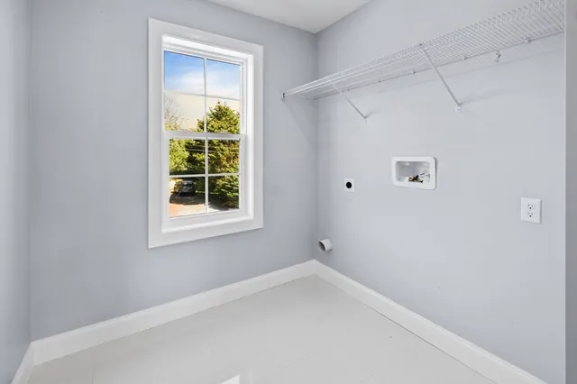 a bathroom with a granite countertop sink a mirror and a toilet