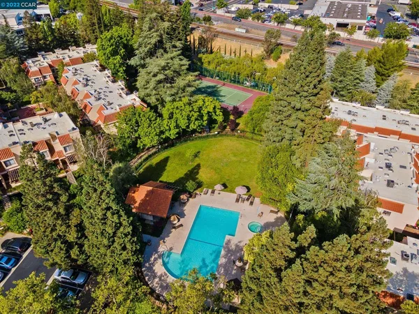 an aerial view of residential house with outdoor space and swimming pool