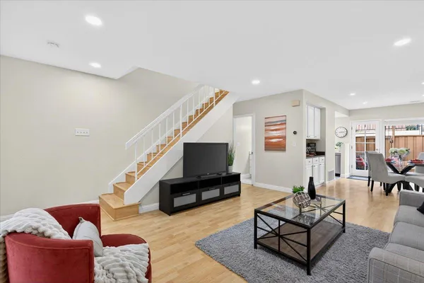 a living room with furniture and a flat screen tv