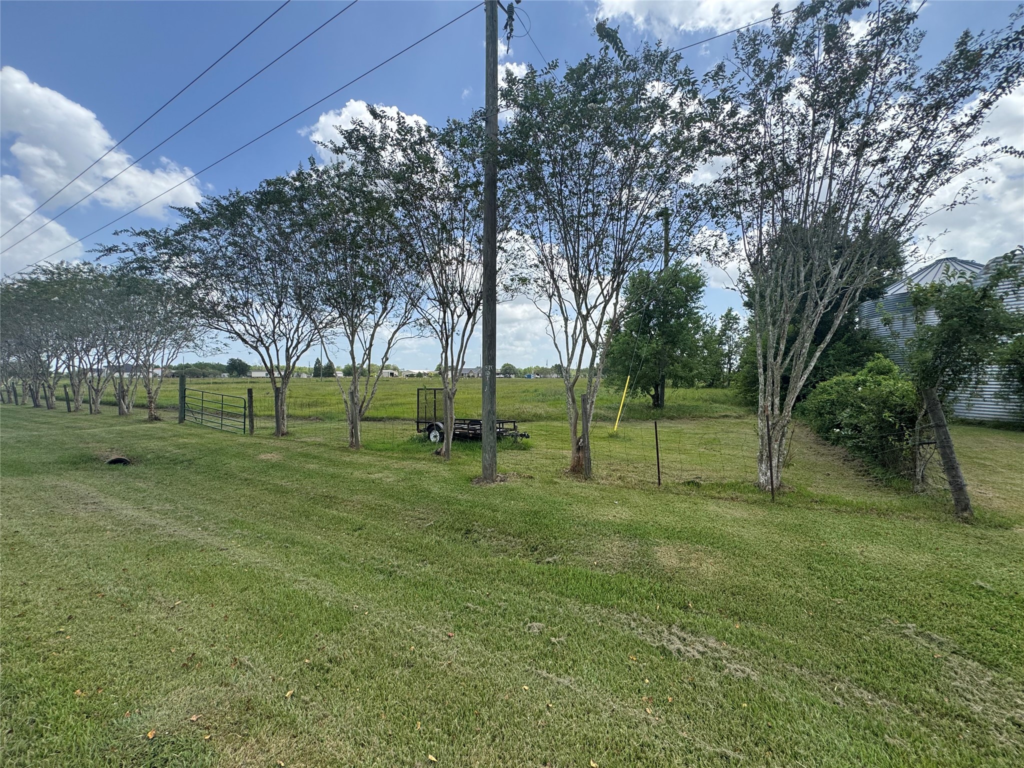 Front view from CR 49. Welcome to 14 acres of peaceful, open fields.