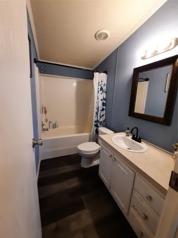 a bedroom with bed and window