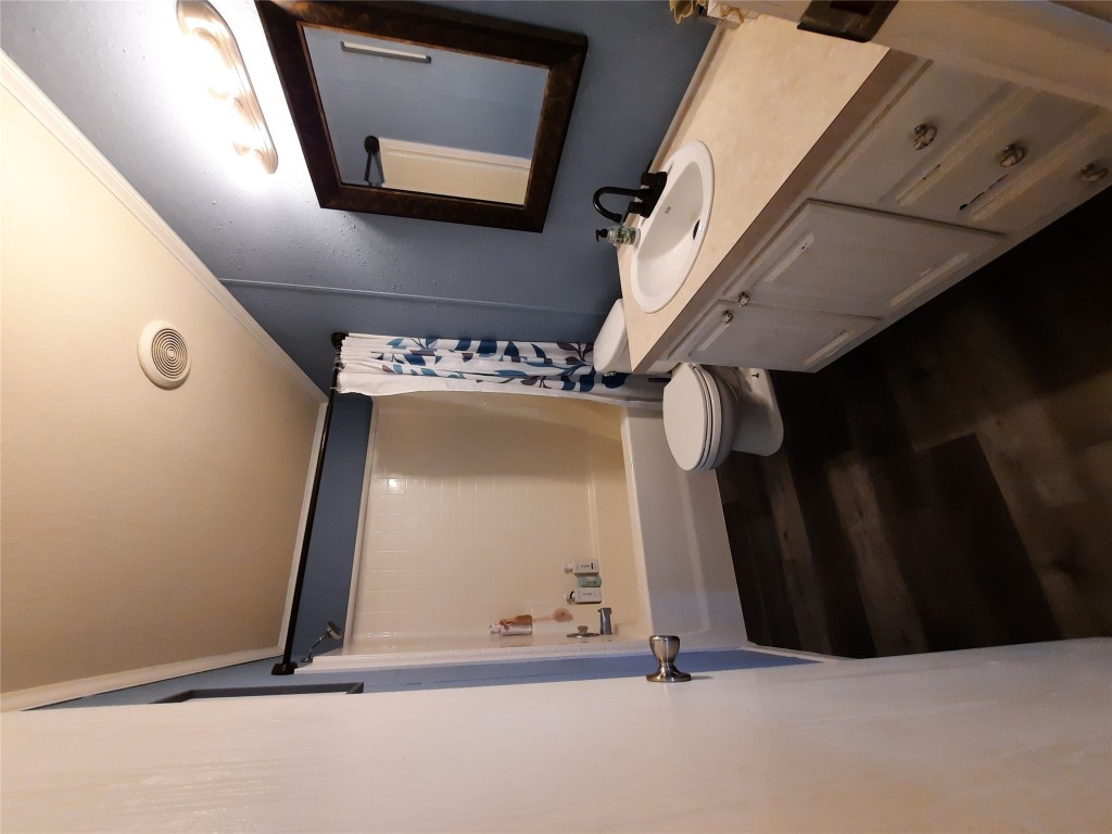 3160 Pettytown Road Dale, TX 78616 - Photo 30 of 37 a bathroom with a sink a toilet and mirror