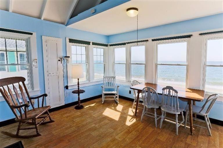 276 Shore Road, Unit 3 Truro, MA 02666 - Photo 5 of 12 a view of a dining room with furniture window and wooden floor