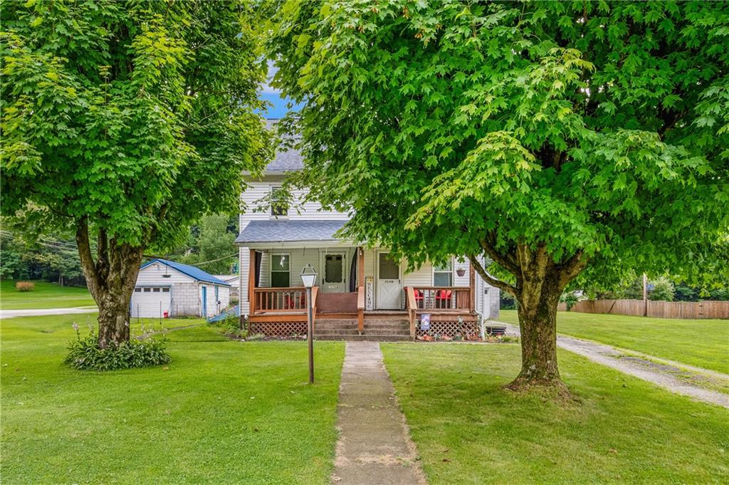2030 Indian Head Road Indian Head, PA 15446 - Photo 2 of 26 a front view of a house with garden