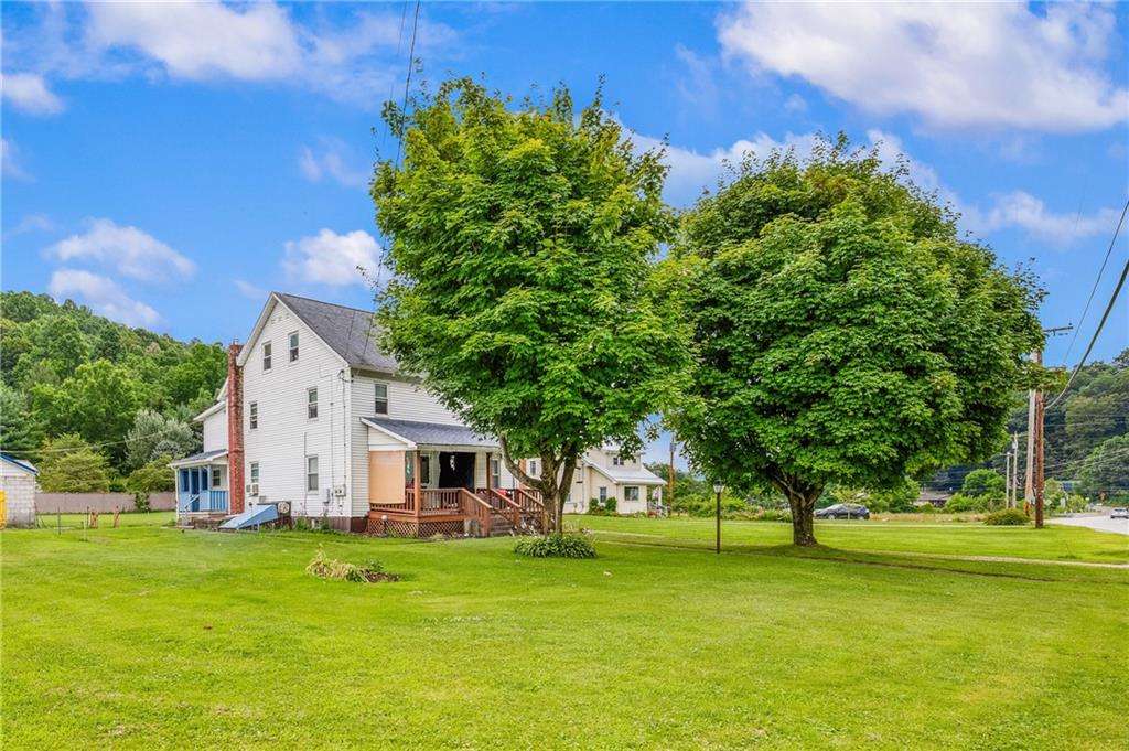 2030 Indian Head Road Indian Head, PA 15446 - Photo 4 of 26 a view of a white house with a big yard