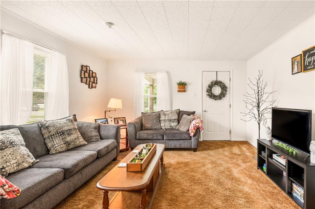 2030 Indian Head Road Indian Head, PA 15446 - Photo 6 of 26 a living room with furniture and a flat screen tv