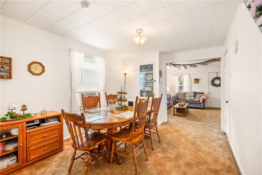 2030 Indian Head Road Indian Head, PA 15446 - Photo 8 of 26 a view of a dining room with furniture and chandelier