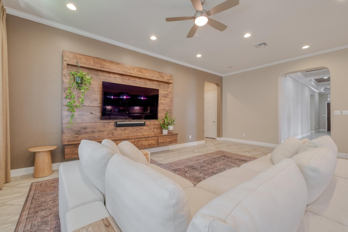 636 Trailside Bend Round Rock, TX 78665 - Photo 12 of 35 a living room with furniture and a flat screen tv