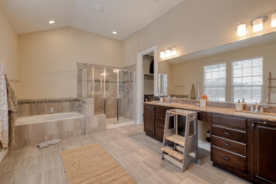 636 Trailside Bend Round Rock, TX 78665 - Photo 20 of 35 a large bathroom with a large tub and sink