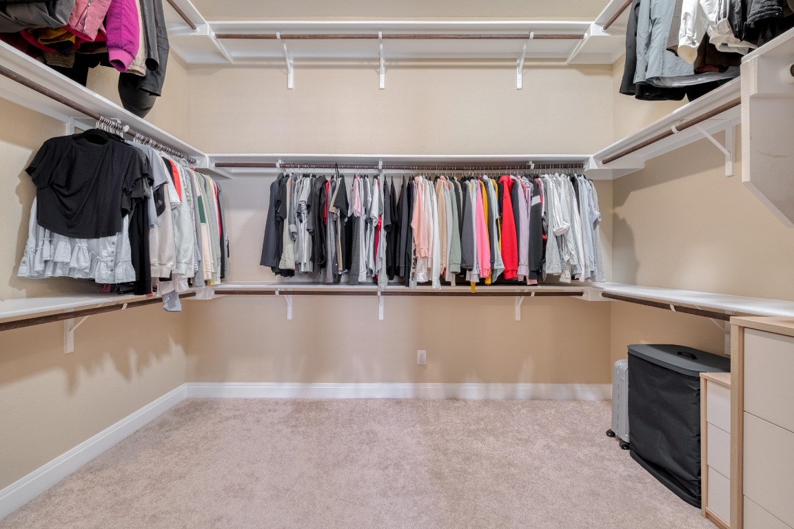636 Trailside Bend Round Rock, TX 78665 - Photo 22 of 35 a view of walk in closet with clothes and shoes