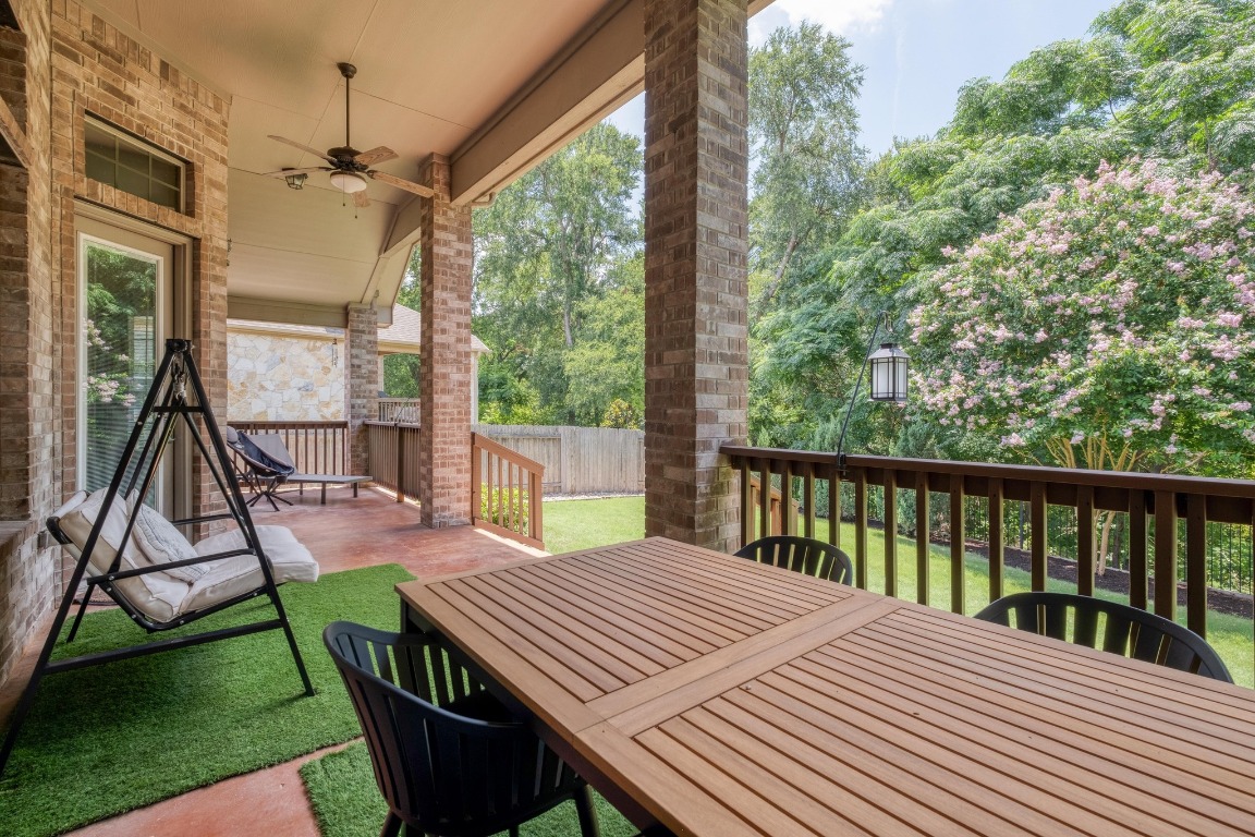 636 Trailside Bend Round Rock, TX 78665 - Photo 30 of 35 a view of a patio with a table chairs and a backyard