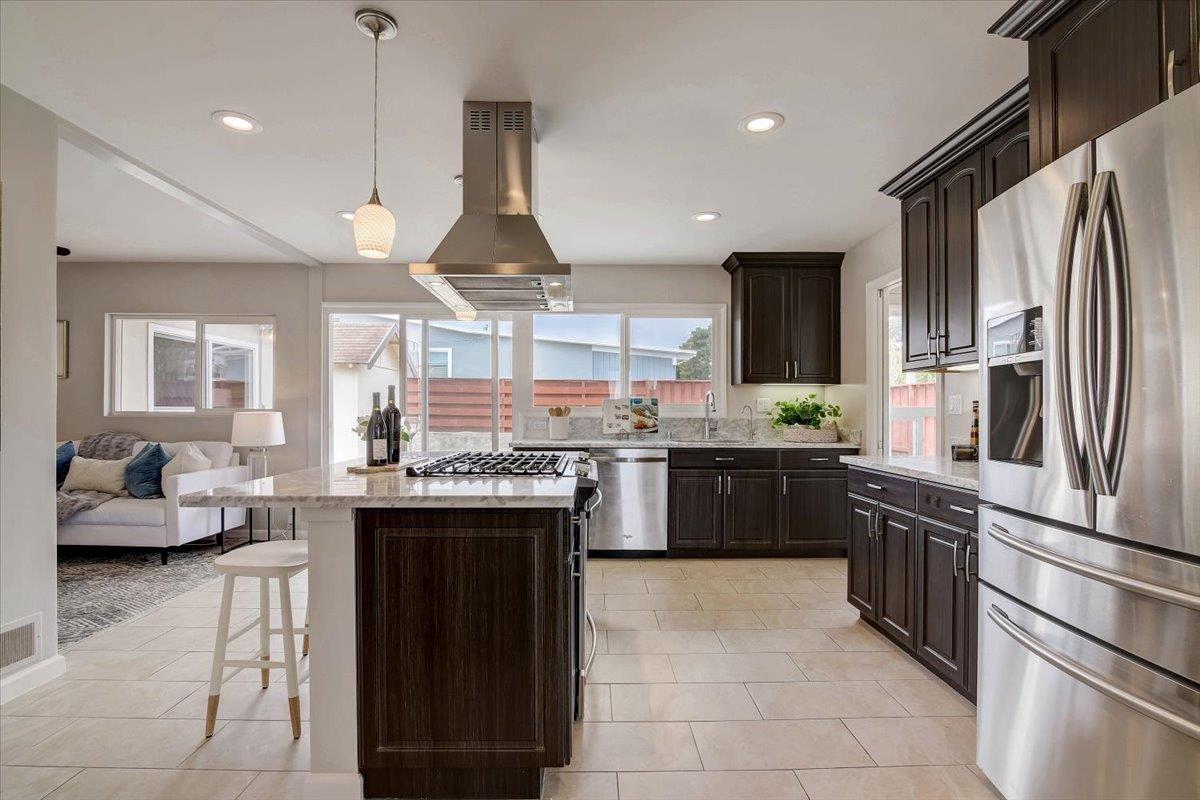 1209 Ridgewood Drive Millbrae, CA 94030 - Photo 12 of 59 a kitchen with stainless steel appliances granite countertop a sink a stove and a refrigerator