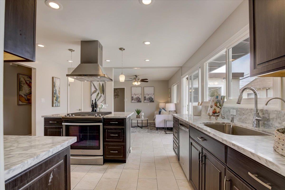1209 Ridgewood Drive Millbrae, CA 94030 - Photo 13 of 59 a kitchen with a stove and a wooden floors