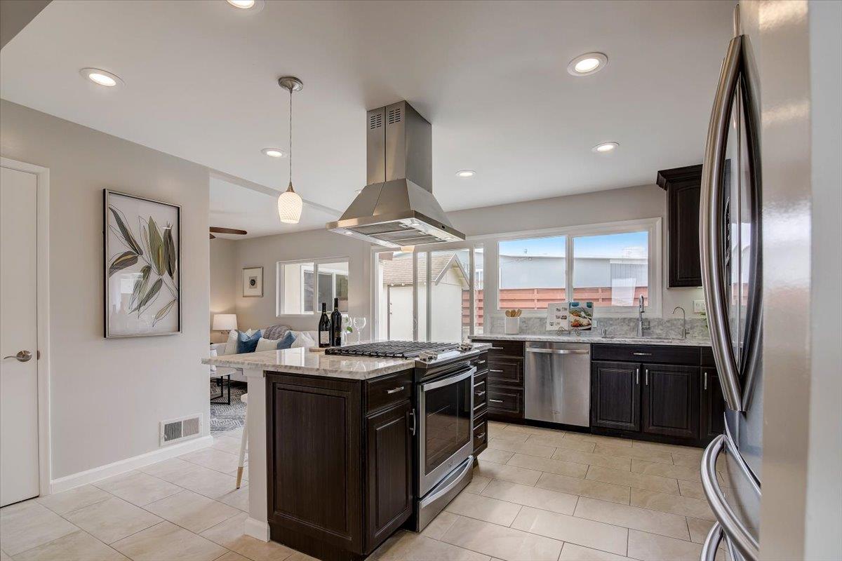 1209 Ridgewood Drive Millbrae, CA 94030 - Photo 14 of 59 a kitchen with stainless steel appliances granite countertop a stove sink and refrigerator