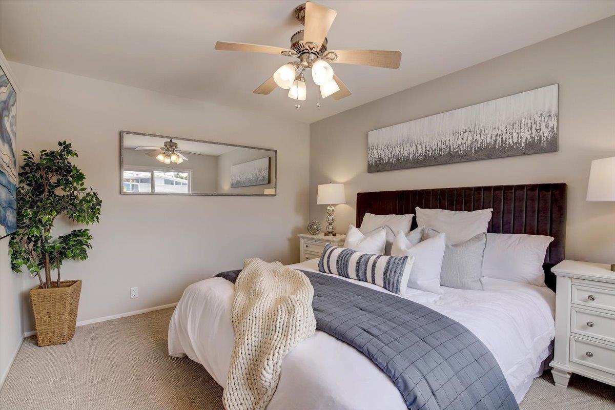 1209 Ridgewood Drive Millbrae, CA 94030 - Photo 23 of 59 a bedroom with bed and a potted plant