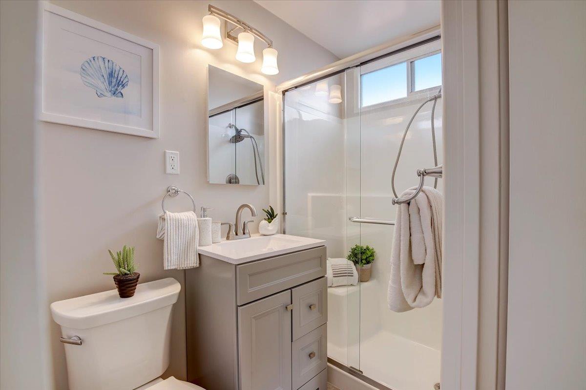 1209 Ridgewood Drive Millbrae, CA 94030 - Photo 25 of 59 a bathroom with a sink toilet and shower