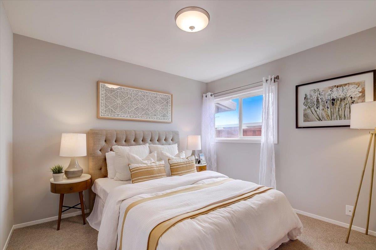 1209 Ridgewood Drive Millbrae, CA 94030 - Photo 27 of 59 a bedroom with bed and painting on the wall