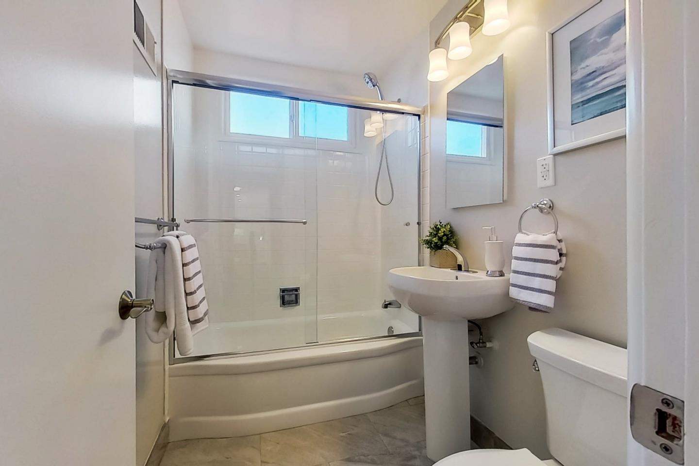 1209 Ridgewood Drive Millbrae, CA 94030 - Photo 30 of 59 a bathroom with a sink a toilet and shower