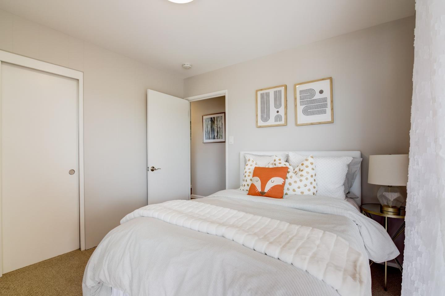 1209 Ridgewood Drive Millbrae, CA 94030 - Photo 31 of 59 a bedroom with a bed and a night stand