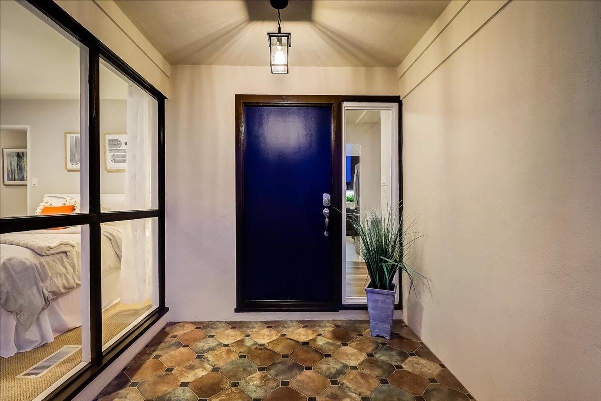 1209 Ridgewood Drive Millbrae, CA 94030 - Photo 4 of 59 a view of a hallway with wooden floor and front door