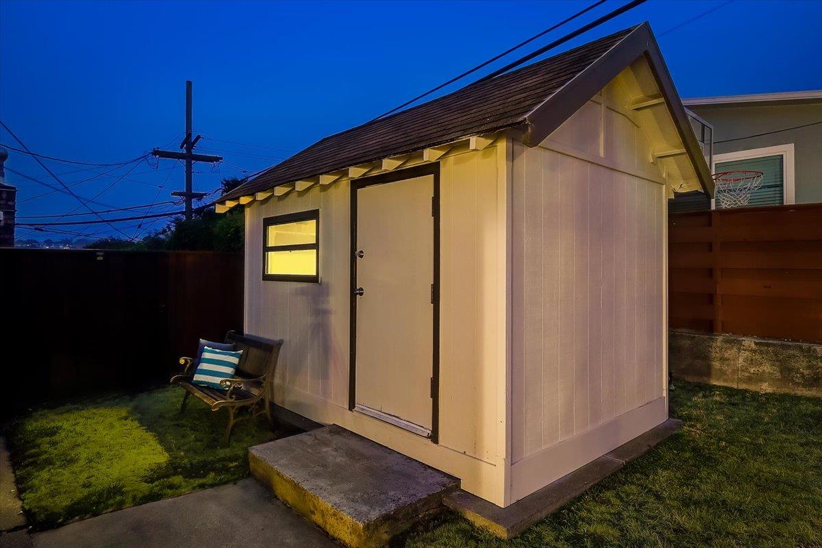 1209 Ridgewood Drive Millbrae, CA 94030 - Photo 44 of 59 a backyard of a house with table and chairs