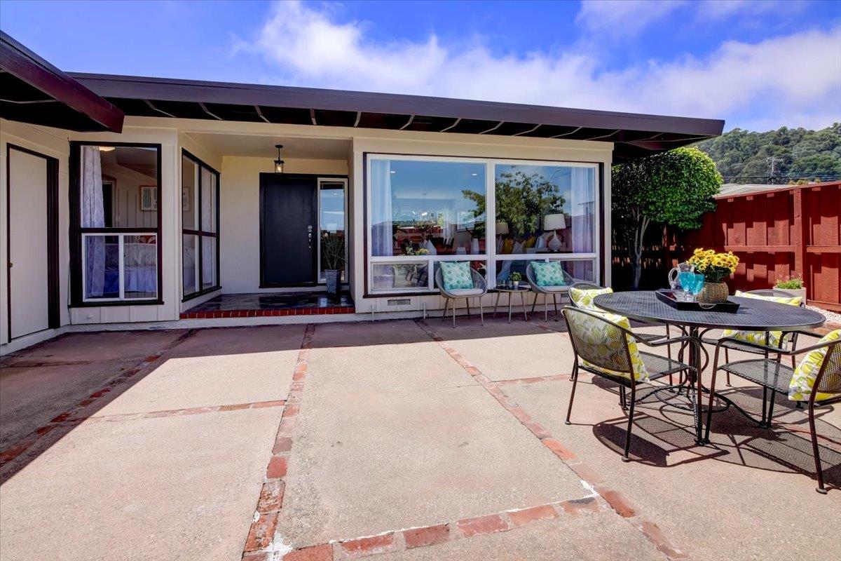 1209 Ridgewood Drive Millbrae, CA 94030 - Photo 48 of 59 a patio with glass top table and chairs