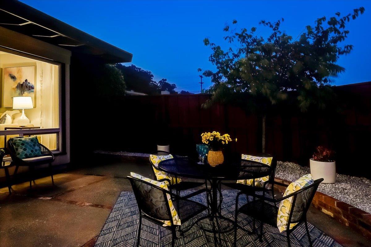 1209 Ridgewood Drive Millbrae, CA 94030 - Photo 53 of 59 a table and chairs in front of a house