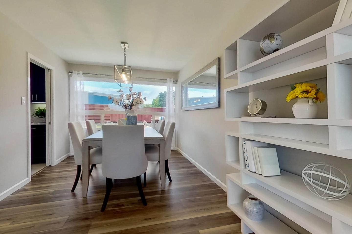 1209 Ridgewood Drive Millbrae, CA 94030 - Photo 9 of 59 a dining room with furniture a chandelier and wooden floor
