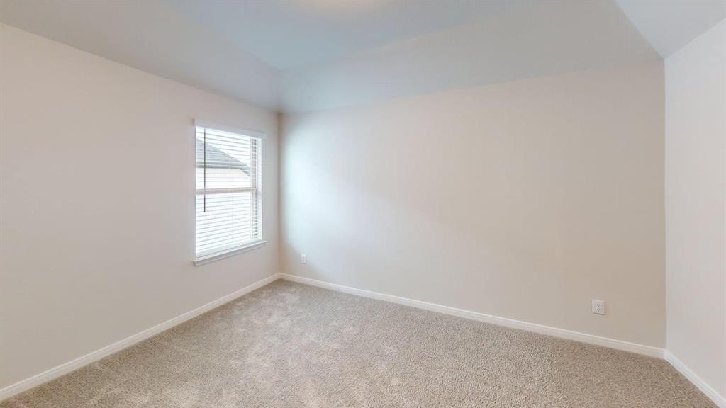 1840 Rosedale Avenue Van Alstyne, TX 75495 - Photo 17 of 24 Neutral-toned carpeting, light wall paint, and a single window with horizontal blinds