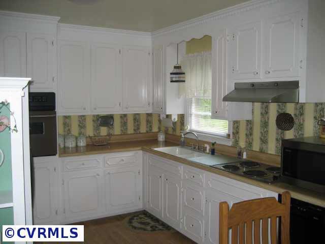 300 Monath Road Richmond, VA 23236 - Photo 6 of 10 a kitchen with stainless steel appliances granite countertop a sink and a stove