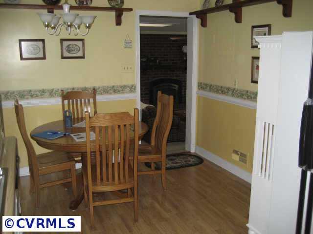 300 Monath Road Richmond, VA 23236 - Photo 7 of 10 a view of a dining room with furniture and wooden floor