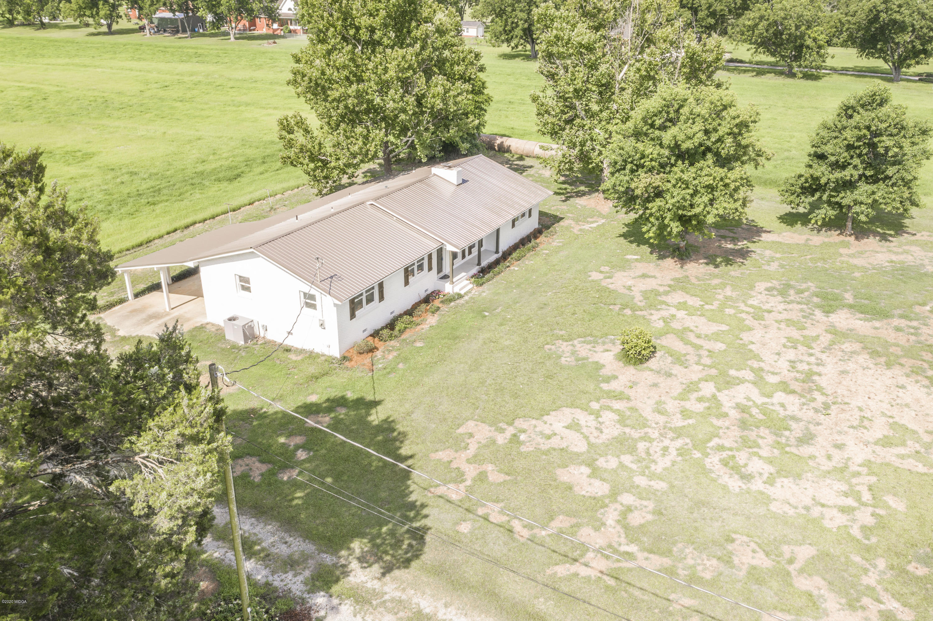 246 Allred Road Byron, GA 31008 - Photo 2 of 53 a view of a big yard with an ocean view