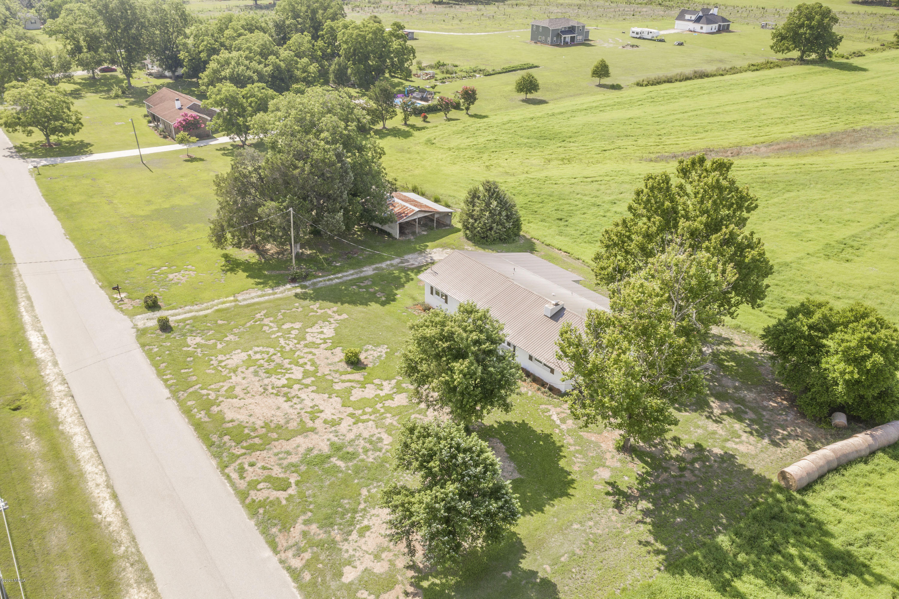 246 Allred Road Byron, GA 31008 - Photo 3 of 53 a view of a lake with a big yard