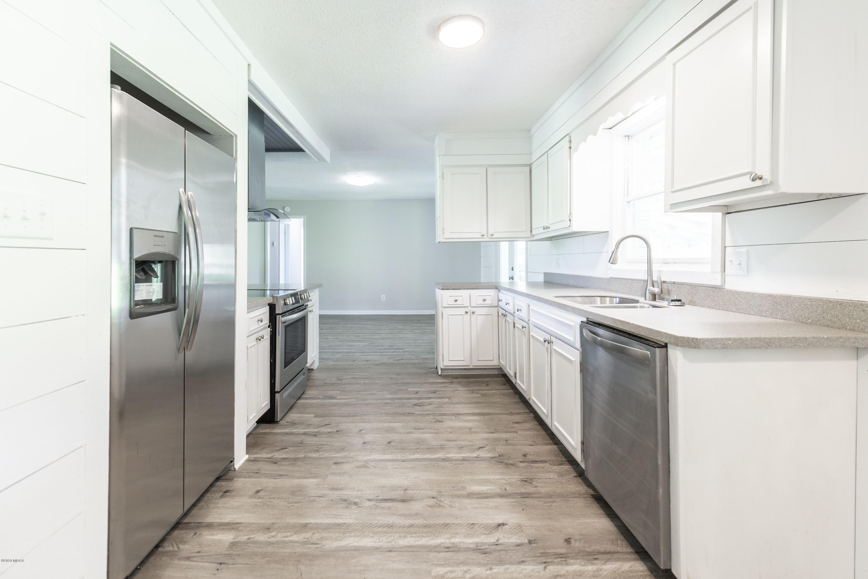 246 Allred Road Byron, GA 31008 - Photo 22 of 53 a kitchen with stainless steel appliances a sink and a refrigerator