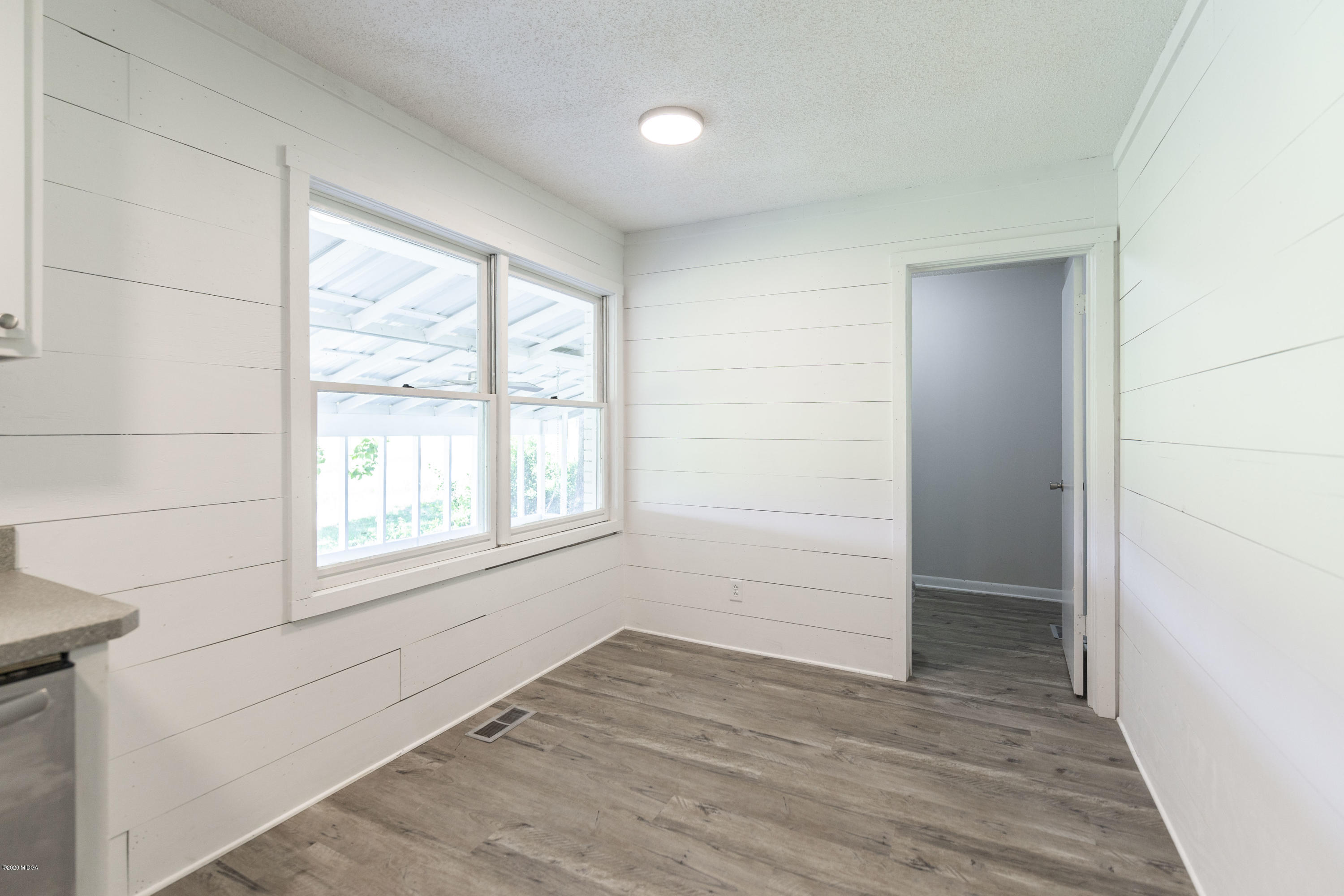 246 Allred Road Byron, GA 31008 - Photo 23 of 53 an empty room with wooden floor and windows