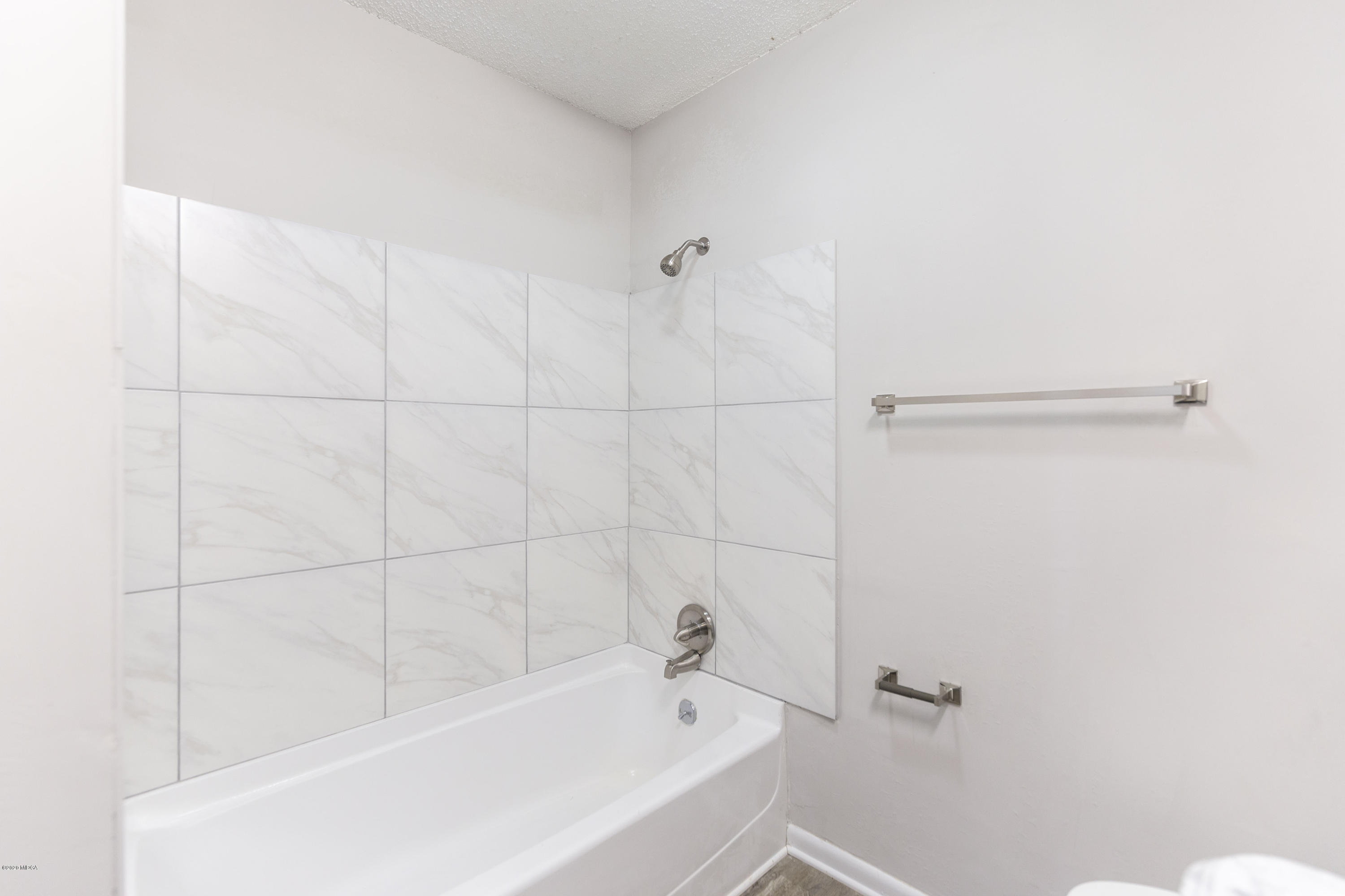 246 Allred Road Byron, GA 31008 - Photo 28 of 53 a white bath tub sitting next to a white sink and vanity