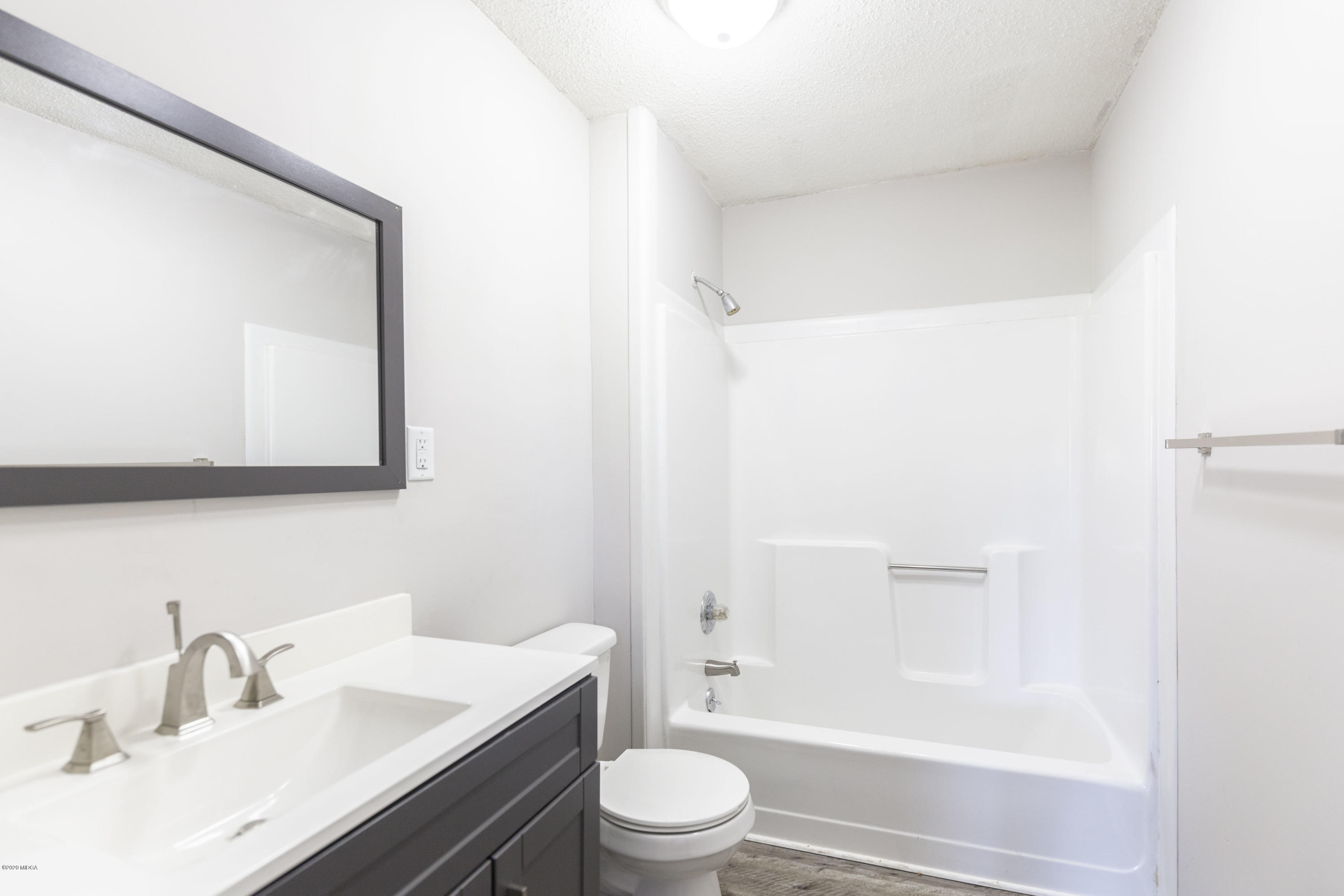 246 Allred Road Byron, GA 31008 - Photo 39 of 53 a bathroom with a sink a toilet and shower