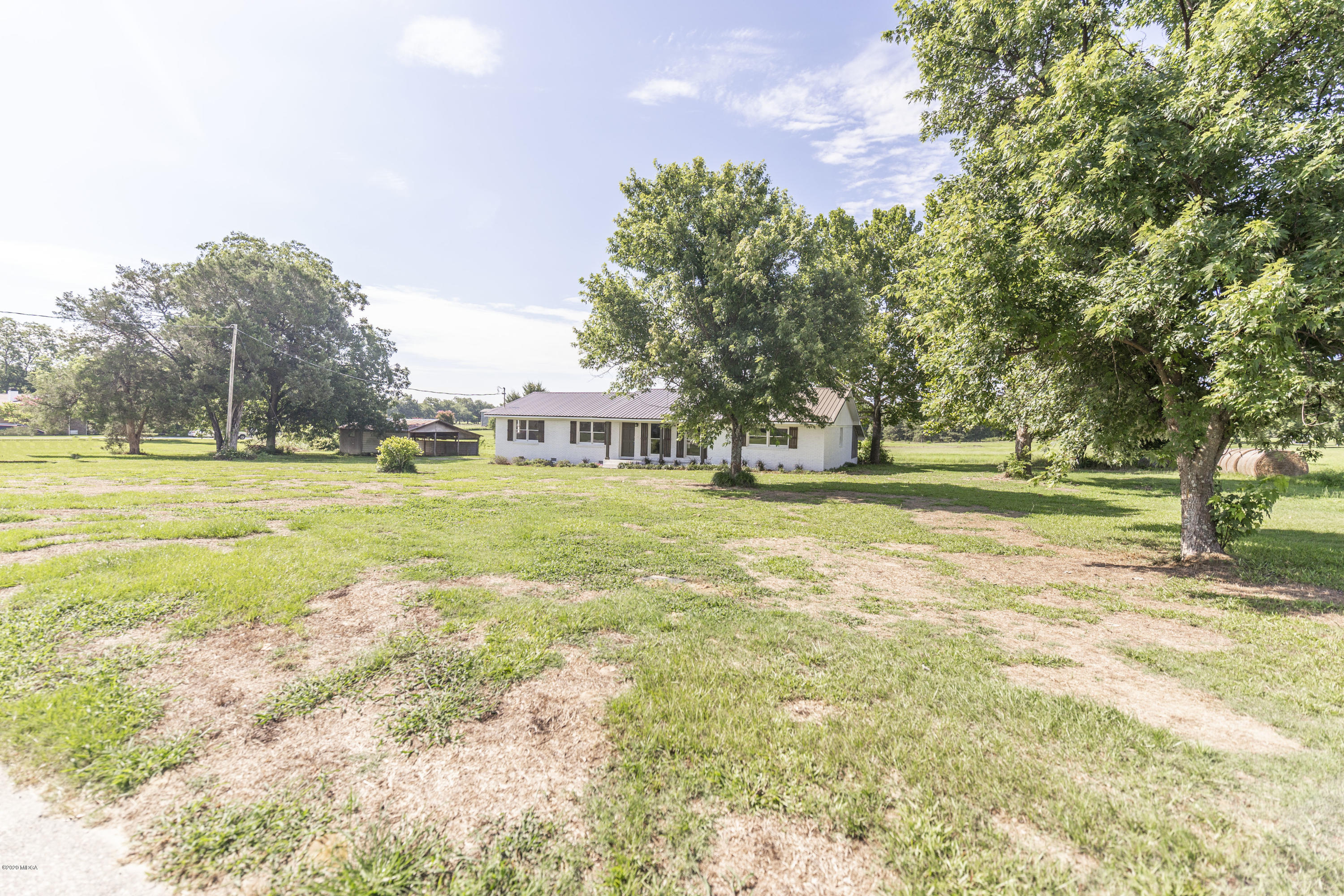246 Allred Road Byron, GA 31008 - Photo 5 of 53 a view of a swimming pool with a yard and trees