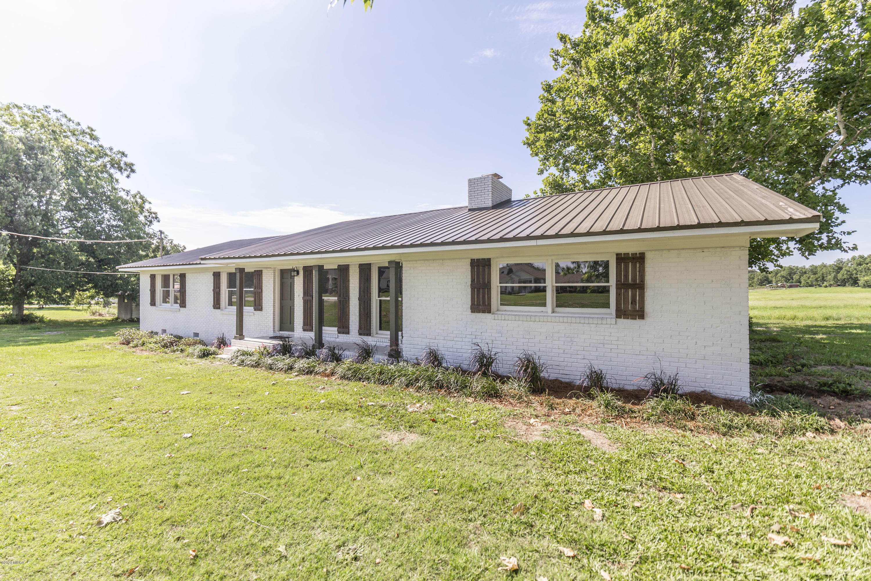 246 Allred Road Byron, GA 31008 - Photo 6 of 53 a front view of a house with a garden