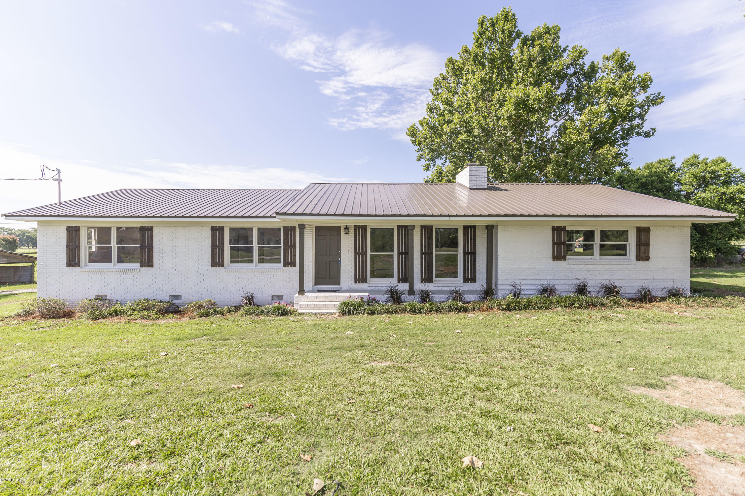 246 Allred Road Byron, GA 31008 - Photo 7 of 53 a front view of a house with a garden