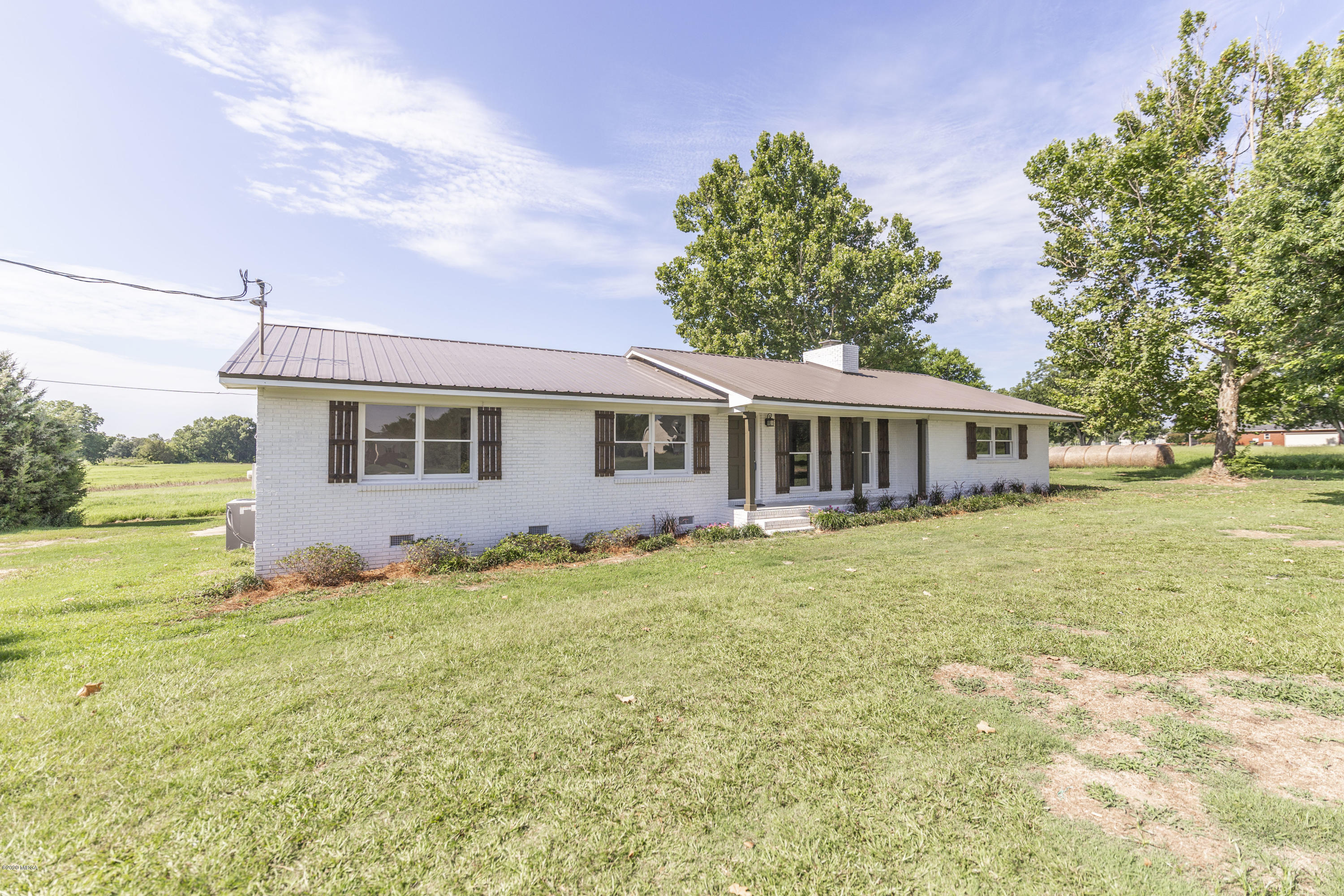 246 Allred Road Byron, GA 31008 - Photo 8 of 53 a front view of a house with a garden