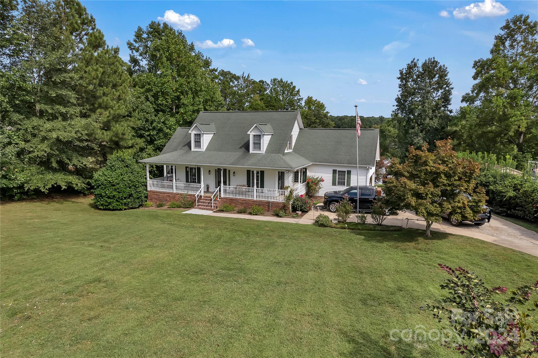 210 Harbor Point Drive Cherryville, NC 28021 - Photo 2 of 45 a front view of a house with swimming pool having outdoor seating