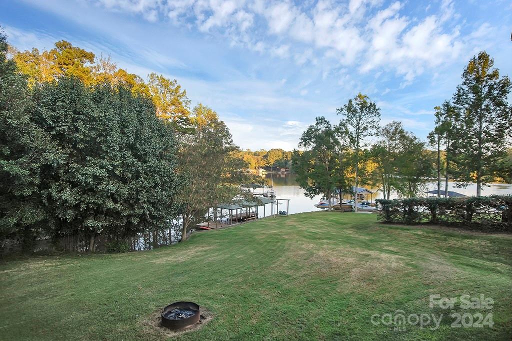 210 Harbor Point Drive Cherryville, NC 28021 - Photo 27 of 45 a view of a field of grass and trees
