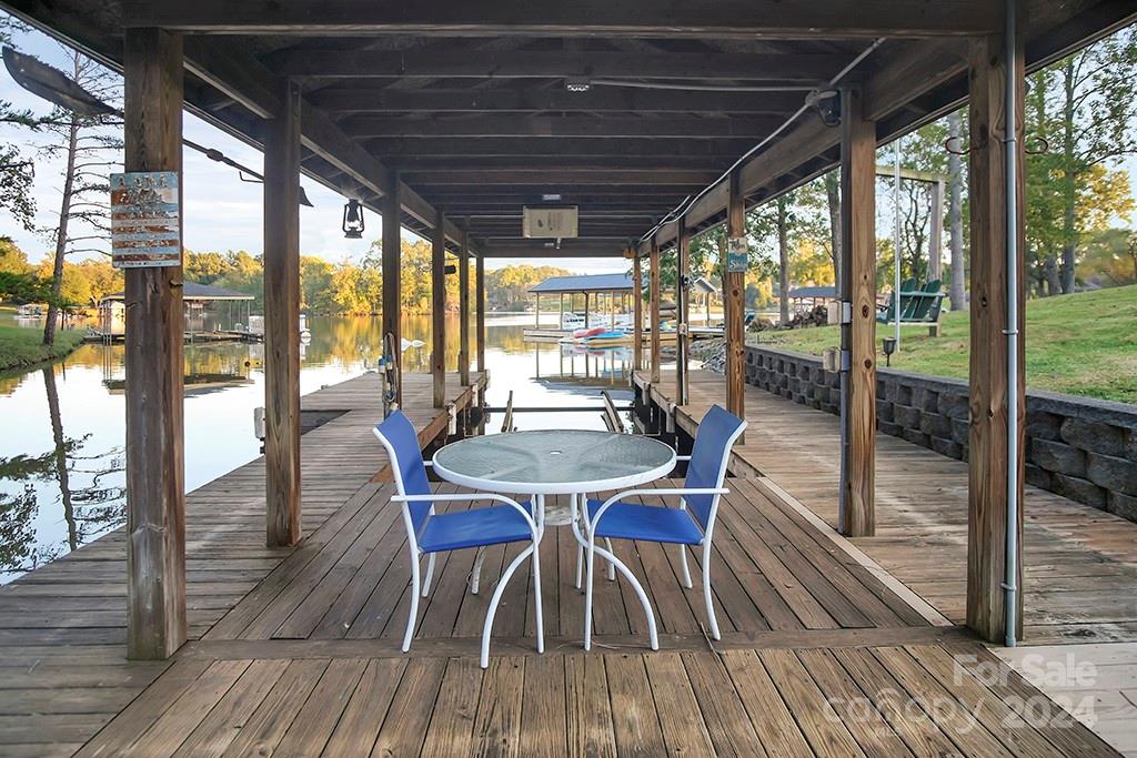 210 Harbor Point Drive Cherryville, NC 28021 - Photo 31 of 45 a dining room with furniture and wooden floor