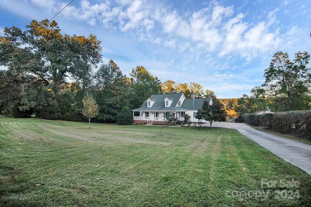 210 Harbor Point Drive Cherryville, NC 28021 - Photo 33 of 45 a backyard of a house with table and chairs
