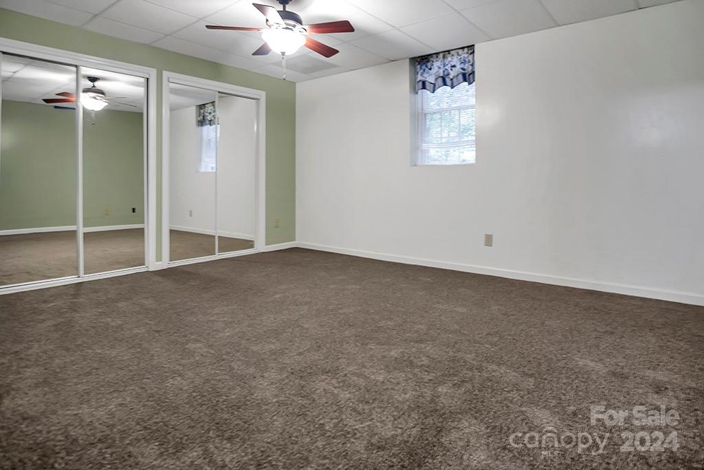 210 Harbor Point Drive Cherryville, NC 28021 - Photo 38 of 45 an empty room with windows and fan